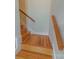 Wooden staircase with simple design and neutral walls at 3624 Ramsey Rd, Sharon, SC 29742