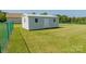 White storage shed in the backyard at 3624 Ramsey Rd, Sharon, SC 29742