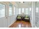 Relaxing sunroom with wicker chairs and hardwood floors at 3624 Ramsey Rd, Sharon, SC 29742