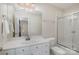 Bright white bathroom features a single sink vanity, toilet, and tiled shower and tub combination at 4316 Mourning Dove Dr, Matthews, NC 28104