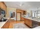 Spacious kitchen with wood cabinets, a breakfast bar, and an open layout perfect for entertaining at 4316 Mourning Dove Dr, Matthews, NC 28104