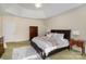 Cozy main bedroom featuring a tray ceiling, a ceiling fan, and ample closet space at 4316 Mourning Dove Dr, Matthews, NC 28104