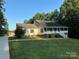 Ranch home with brick facade and front porch at 475 Cornerstone Dr, Taylorsville, NC 28681