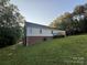 Back of house with deck and wooded area at 475 Cornerstone Dr, Taylorsville, NC 28681