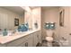 Double vanity bathroom with large mirror and teal accents at 5142 Hyrule Dr, Charlotte, NC 28262