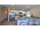 Modern kitchen with white cabinets and granite countertops at 5142 Hyrule Dr, Charlotte, NC 28262