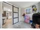 Basement area with sliding barn doors and a view of the kitchen in the background at 5483 Paulmo Dr, Charlotte, NC 28216