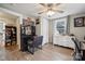 Bright bedroom featuring light wood floors, dresser, and a makeup vanity at 5483 Paulmo Dr, Charlotte, NC 28216