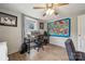 Bright room with a ceiling fan, and a large colorful wall art at 5483 Paulmo Dr, Charlotte, NC 28216