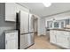 Modern kitchen featuring stainless steel refrigerator and appliances with ample storage at 5483 Paulmo Dr, Charlotte, NC 28216