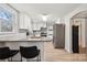 Modern kitchen with granite countertops, white cabinetry, and stainless steel appliances at 5483 Paulmo Dr, Charlotte, NC 28216