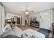 Open-concept living room with a view into the kitchen and front entryway at 5483 Paulmo Dr, Charlotte, NC 28216