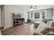 Inviting living room with a large sectional sofa and natural light from the windows at 5483 Paulmo Dr, Charlotte, NC 28216