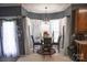 Cozy kitchen dining area with glass table and four chairs at 5711 Falls Ridge Ln, Charlotte, NC 28269