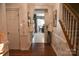 Bright entryway with hardwood floors and a view into the dining area at 5711 Falls Ridge Ln, Charlotte, NC 28269