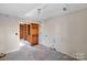 Small basement bedroom with carpeted floor at 6017 Millbury Ct # 16, Charlotte, NC 28211