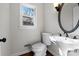 Elegant bathroom with pedestal sink and oval mirror at 6017 Millbury Ct # 16, Charlotte, NC 28211