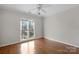 Bedroom with hardwood floors and large window at 6017 Millbury Ct # 16, Charlotte, NC 28211