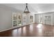 Bright dining room with hardwood floors, fireplace, and access to deck at 6017 Millbury Ct # 16, Charlotte, NC 28211