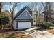 Gray two-story house with attached garage, viewed from the driveway at 6017 Millbury Ct # 16, Charlotte, NC 28211