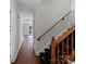 Wooden staircase with floral patterned runner at 6017 Millbury Ct # 16, Charlotte, NC 28211