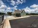 Exterior of the community clubhouse with a swimming pool and plenty of parking space at 624 Cassidy Ct, Clover, SC 29710
