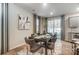 Bright dining area with sliding glass doors leading to a patio, modern decor, and natural light at 624 Cassidy Ct, Clover, SC 29710