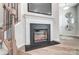 Modern fireplace with a black surround, mantle, and a wall-mounted television above it at 624 Cassidy Ct, Clover, SC 29710