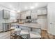 Modern kitchen boasts granite countertops, stainless steel appliances, and an island with bar seating for casual dining at 624 Cassidy Ct, Clover, SC 29710