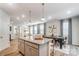 Well-designed kitchen featuring a spacious island, granite countertops, and an open layout that connects to the dining room at 624 Cassidy Ct, Clover, SC 29710