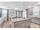Open-concept kitchen featuring a large island, granite countertops, and a seamless transition to the dining and living areas at 624 Cassidy Ct, Clover, SC 29710