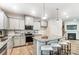 Open kitchen with an island, granite countertops, stainless appliances, and adjacent breakfast bar at 624 Cassidy Ct, Clover, SC 29710