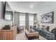 Cozy living room with a plush sofa, modern decor, and ample natural light at 624 Cassidy Ct, Clover, SC 29710