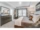 Spacious main bedroom features a tray ceiling, a large window, and neutral decor at 624 Cassidy Ct, Clover, SC 29710
