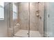 Glass enclosed shower with white marble surround and built in bench at 624 Cassidy Ct, Clover, SC 29710