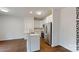 Modern kitchen with white cabinets, stainless steel appliances, and marble countertops at 715 Queens Ct, Gastonia, NC 28052