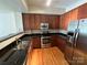 Modern kitchen with stainless steel appliances and granite countertops at 721 Governor Morrison St, Charlotte, NC 28211