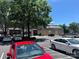 Parking lot with cars parked near shops and businesses in a shopping center at 721 Governor Morrison St, Charlotte, NC 28211