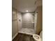 Updated shower with wave patterned tile and glass enclosure at 721 Governor Morrison St, Charlotte, NC 28211