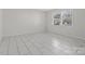 Simple bedroom with neutral walls and tile floors at 7530 Holly Grove Ct, Charlotte, NC 28227