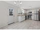 Eat-in kitchen, white cabinets, stainless steel appliances at 7530 Holly Grove Ct, Charlotte, NC 28227