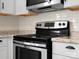 Stainless steel range and microwave at 7530 Holly Grove Ct, Charlotte, NC 28227