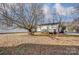 Home with a large backyard, partial view of back deck and shed at 776 Washington Ln, Kannapolis, NC 28083