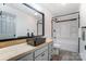 Bathroom featuring a black vessel sink, modern vanity, and shower-tub combo at 776 Washington Ln, Kannapolis, NC 28083