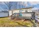 View of the back of the home with a painted door and a back deck at 776 Washington Ln, Kannapolis, NC 28083