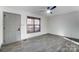 Bright living room features modern ceiling fan and natural light from a window at 776 Washington Ln, Kannapolis, NC 28083