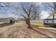 Storage shed in backyard with a large tree at 776 Washington Ln, Kannapolis, NC 28083