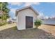 Image of storage shed in backyard with mature trees and partial view of home at 776 Washington Ln, Kannapolis, NC 28083