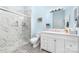 Bathroom featuring a glass enclosed shower with marble tile and a modern vanity at 780 N Davidson St, Charlotte, NC 28202