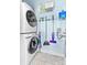 Laundry room with stacked washer and dryer and storage solutions at 780 N Davidson St, Charlotte, NC 28202